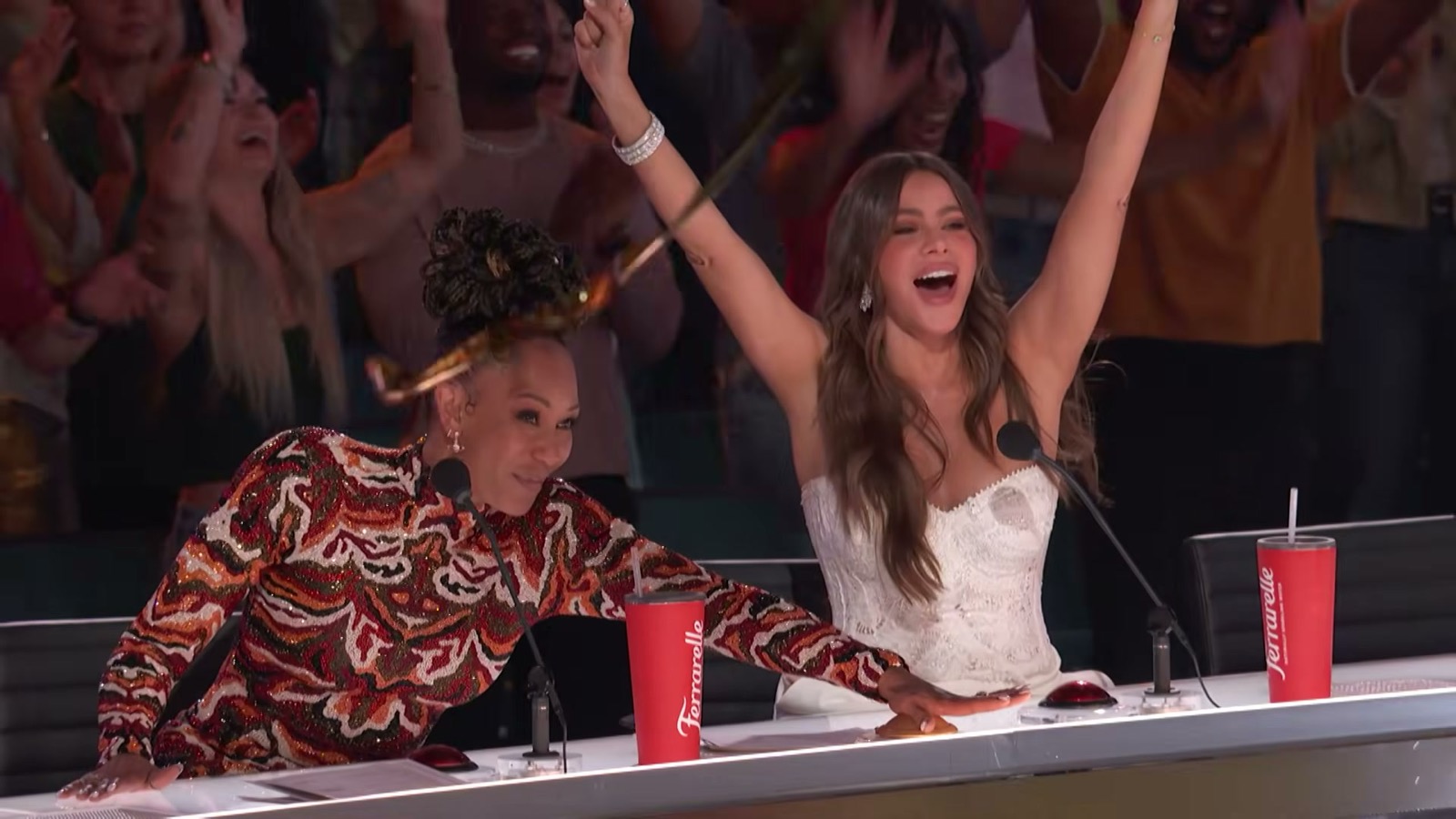 Judges Mel B and Sofia Vergara on their feet with arms raised at the America&rsquo;s Got Talent panel, the moment Mel B hit the Golden Buzzer for Nene Royal, August 25, 2026
