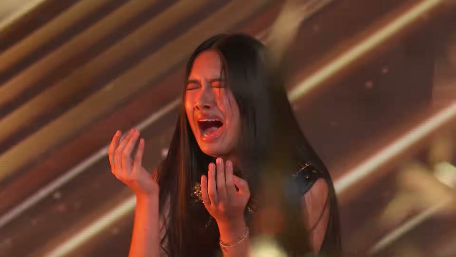 Close-up of Nene Royal singing during her Live Quarterfinals performance of Soundgarden's 'Black Hole Sun' on America's Got Talent, August 25, 2026
