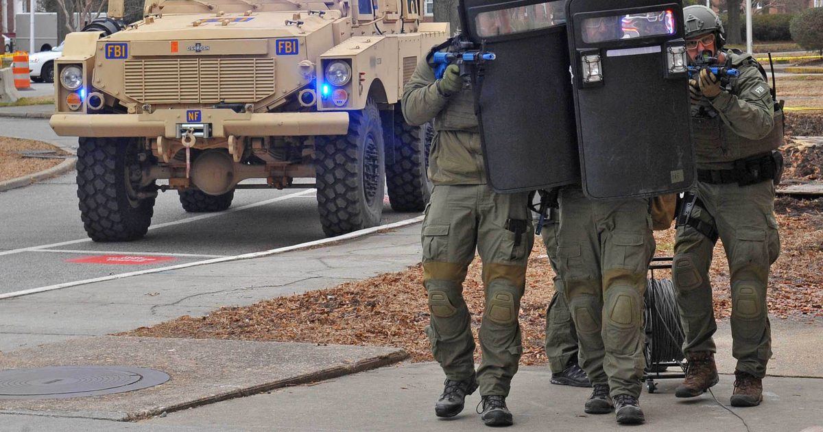 FBI SWAT operators in tactical gear during a training exercise, the kind of armed response a fake emergency call can trigger at a real address